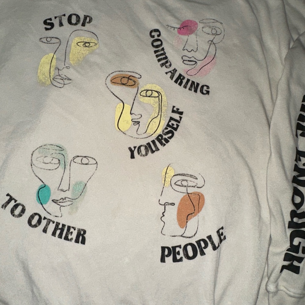 White Graphic Pullover Sweatshirt with Multicolor Abstract Faces